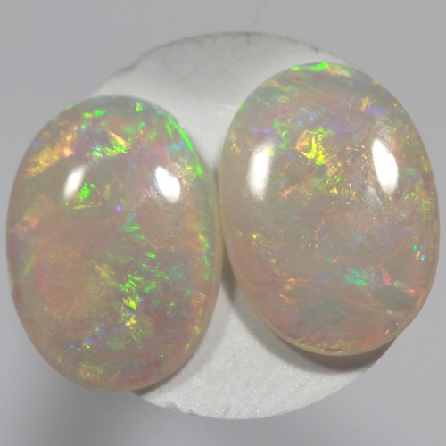 SOLID SEMI BLACK OPALS Matching pair, bright green and orange